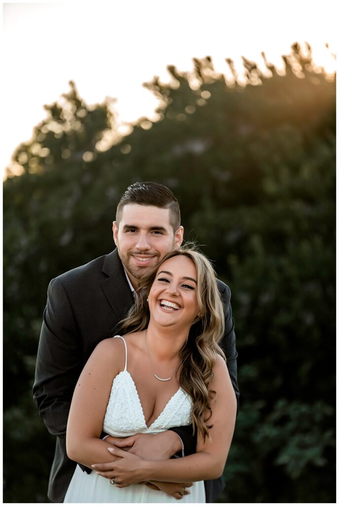 Howard beach couple beach engagement photos laughing