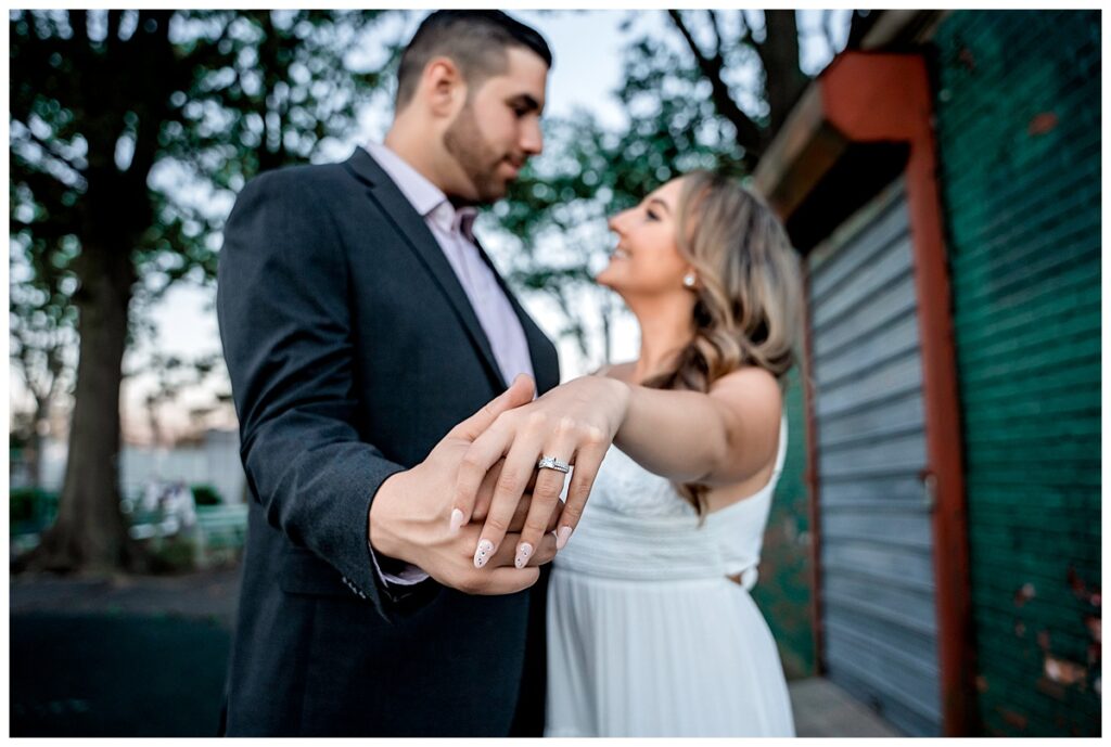 Howard beach couple beach engagement photos ring focus