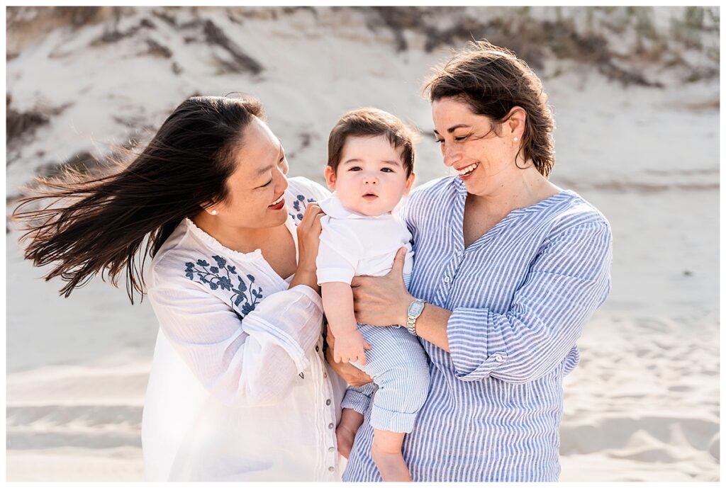 two moms and baby boy family photos on the beach same sex