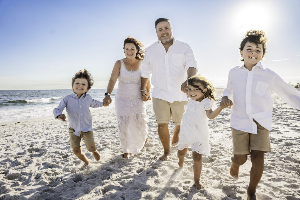 Long island family photographer family running on the beach