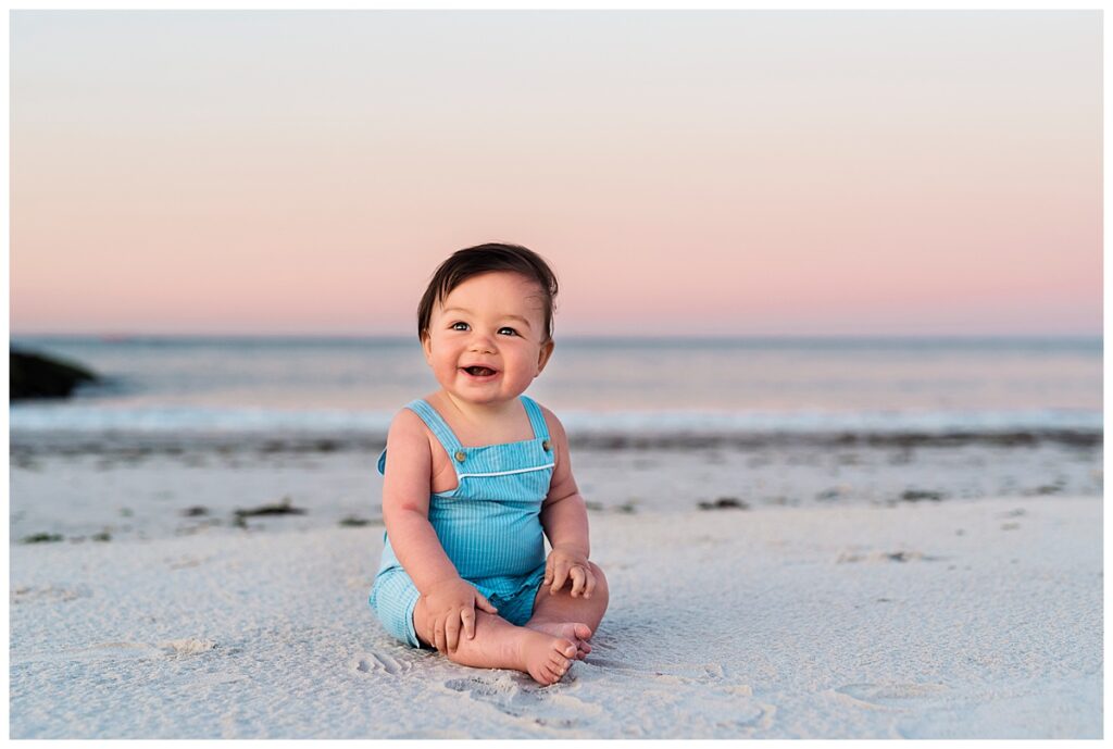 The best portrait photographer on long island baby on the beach