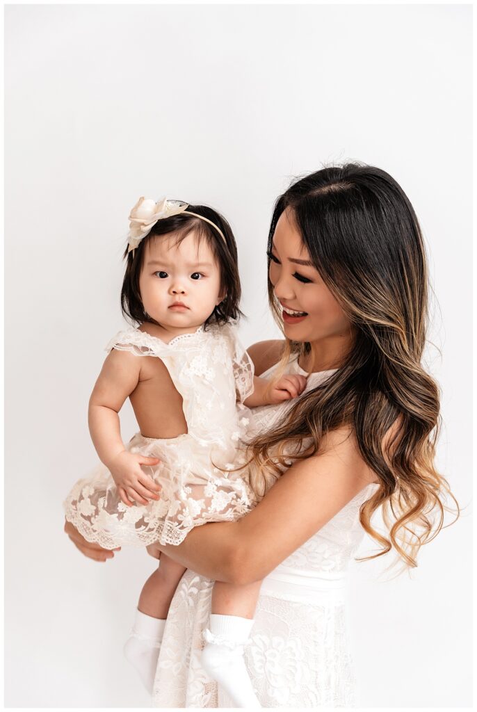 Light and Bright Family Photos in the Studio mom and baby girl