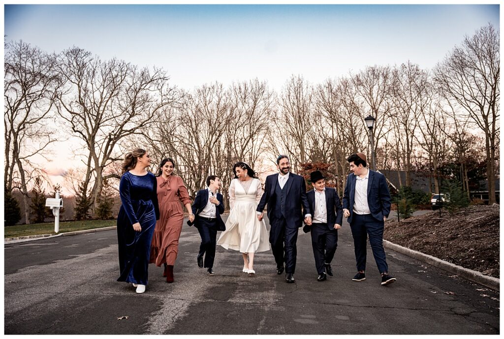 Warm and happy couple photos for cool december wedding the whole family