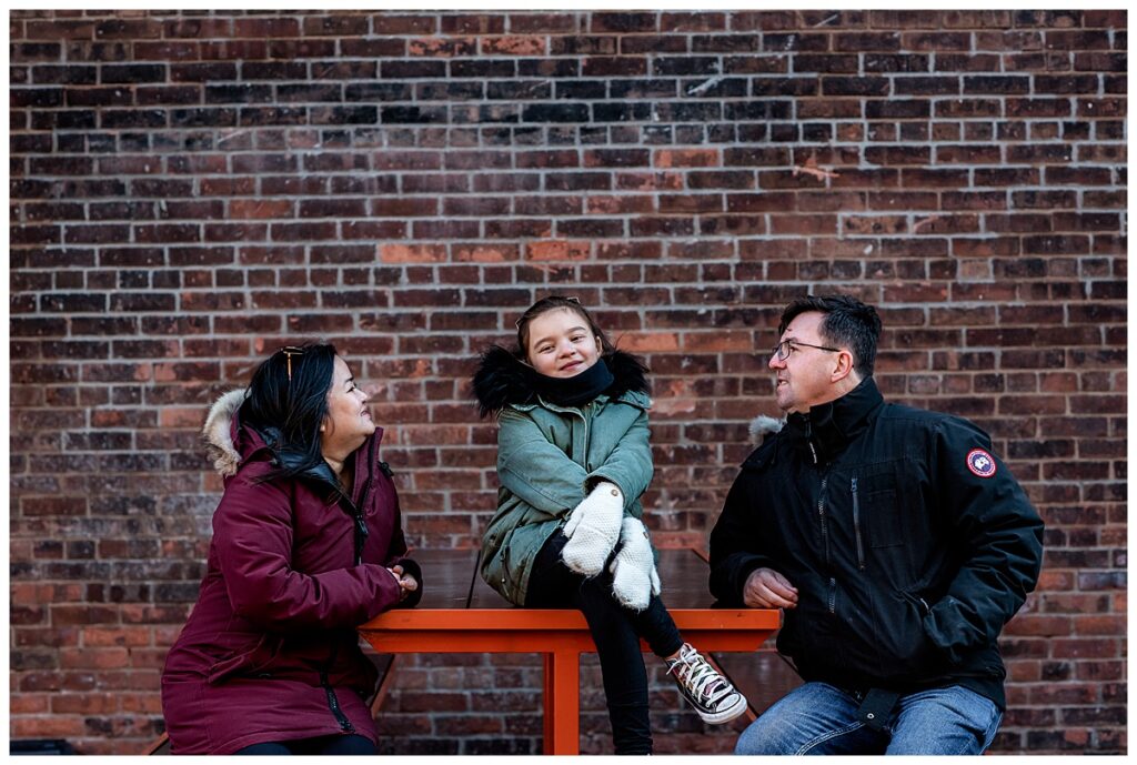 An Easy Going Family Session at Brooklyn Bridge Park brick wall