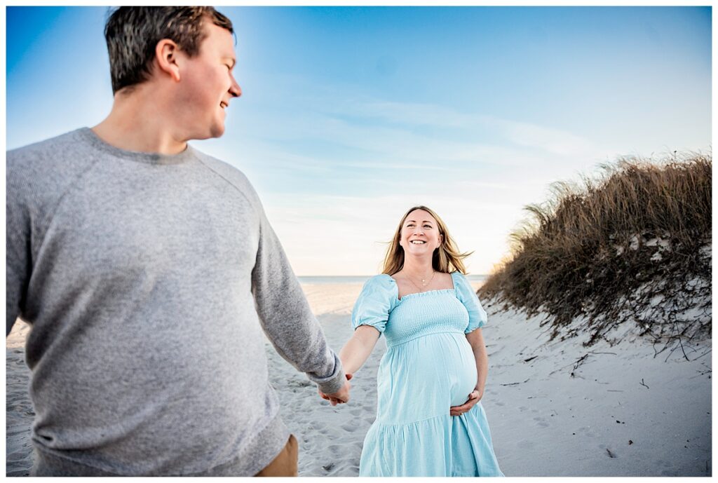 Natural and Breezy Sunset Maternity Photos on the Beach playful prompt