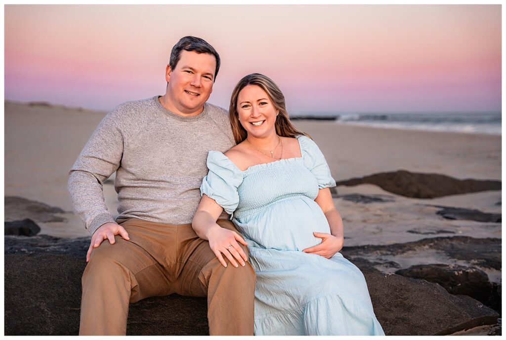 Natural and Breezy Sunset Maternity Photos on the Beach sitting pose