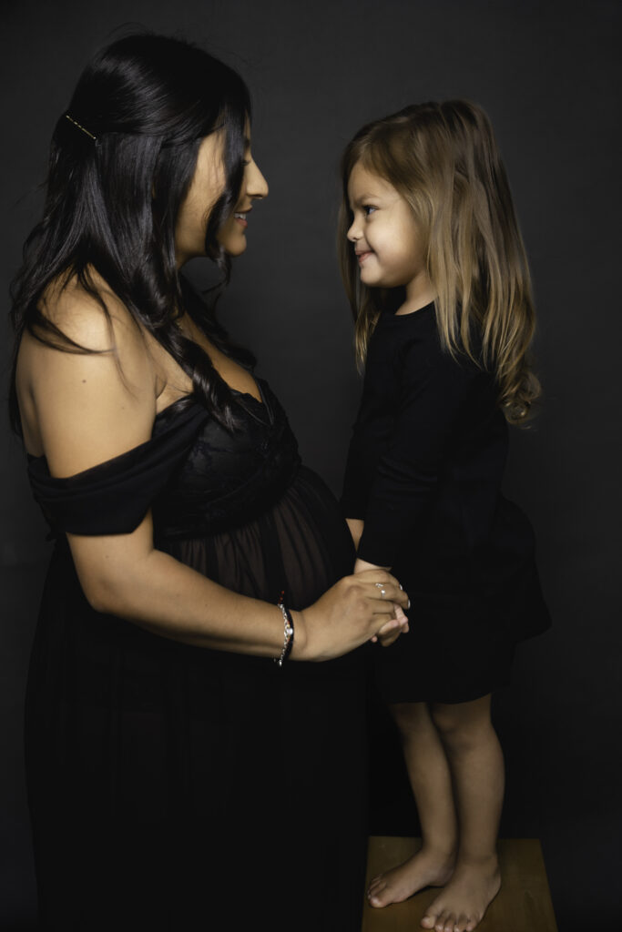 Dreamy Mommy and Me Maternity Photos in the Studio big sister
