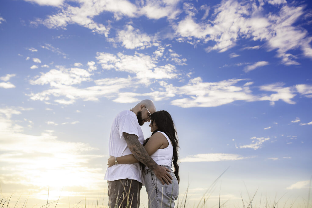 land Family Photographer couple and sky