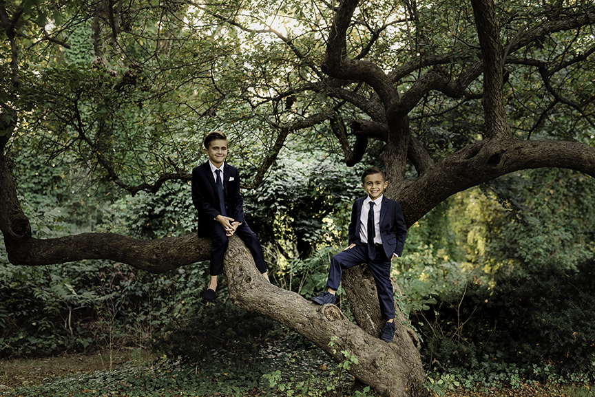 Long Island Communion Photographer boys in suites in a tree