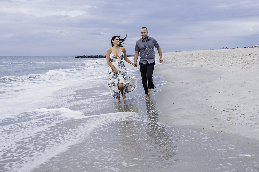 Long Island Natural Couple Photographer running on beach