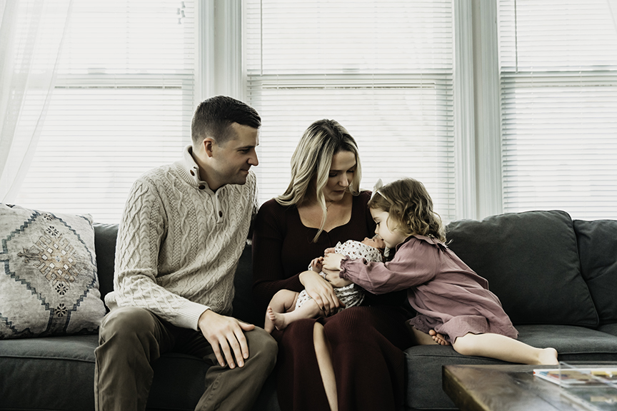 Cozy and Playful In Home New Baby Photos kisses