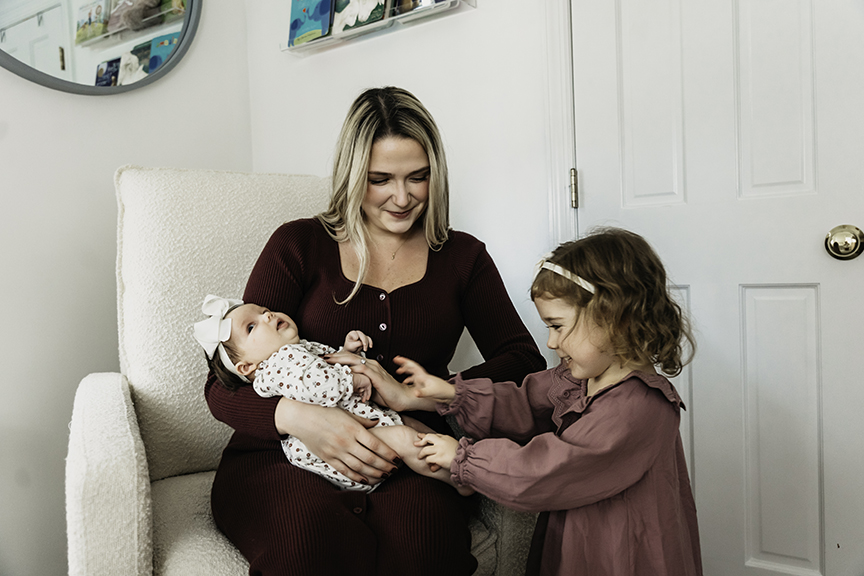 Cozy and Playful In Home New Baby Photos sisters