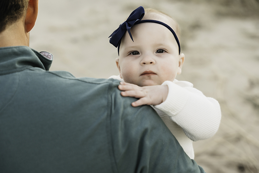 Big brother and baby sister family photos on Long Island dad's shoulder