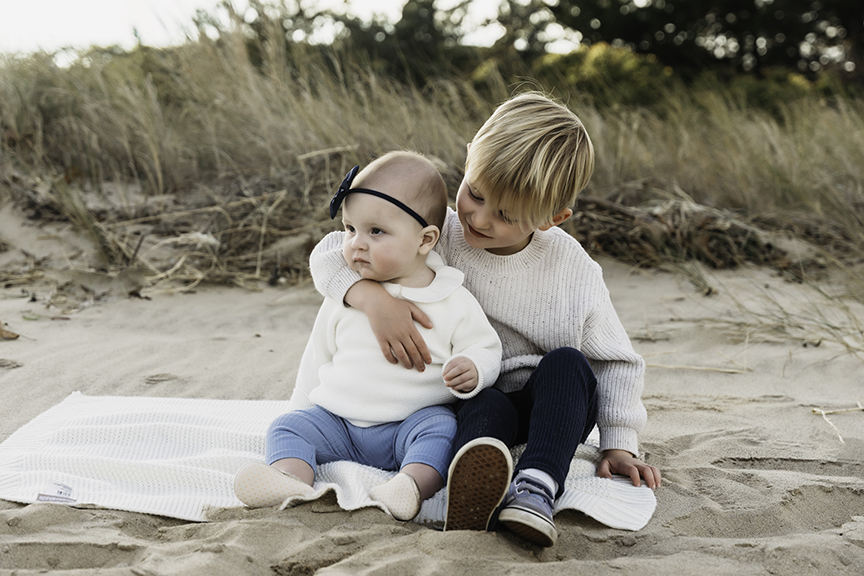 Big brother and baby sister family photos on Long Island hug