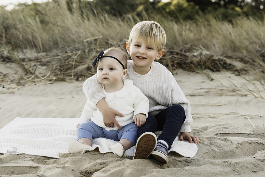 Big brother and baby sister family photos on Long Island smiles
